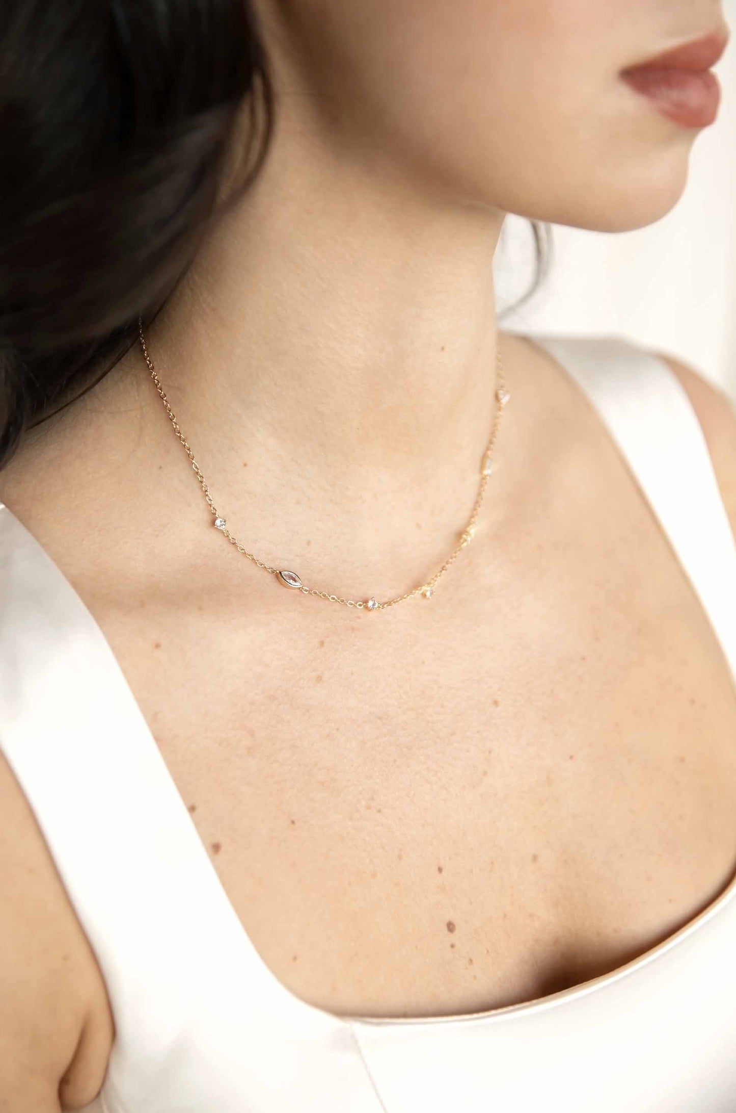 Shapely Crystals Necklace on a model in 18k gold plated