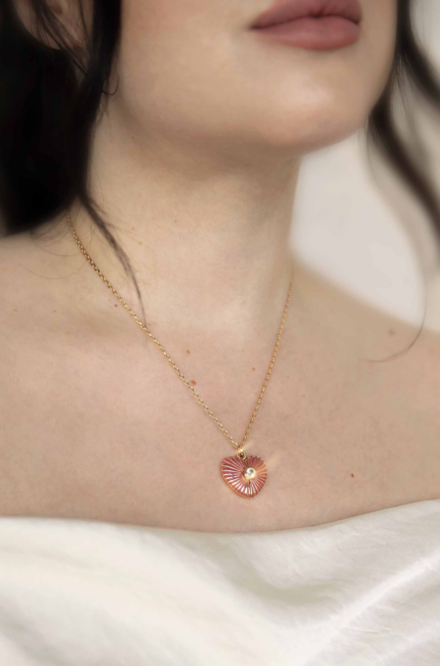 Radiate Love Hidden Message Locket Necklace on a model
