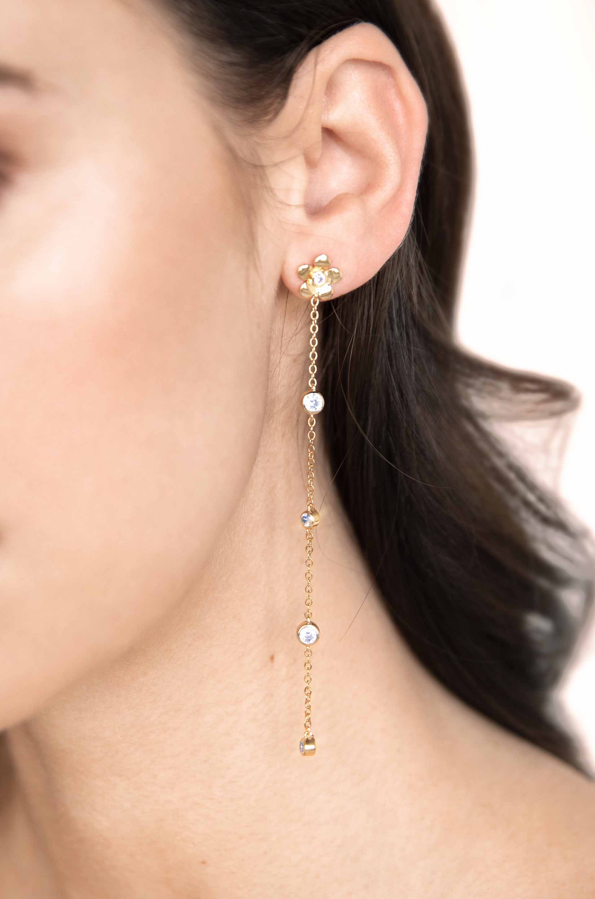 Single Flower Linear Dangle 18k Gold Plated Earrings on a model