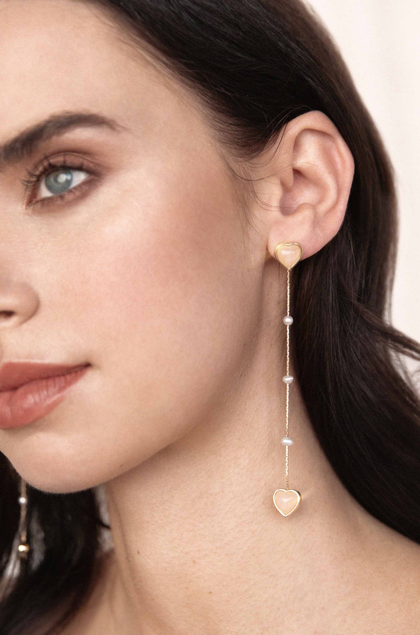 Stoned Heart 18k Gold Plated Drop Earrings on a model