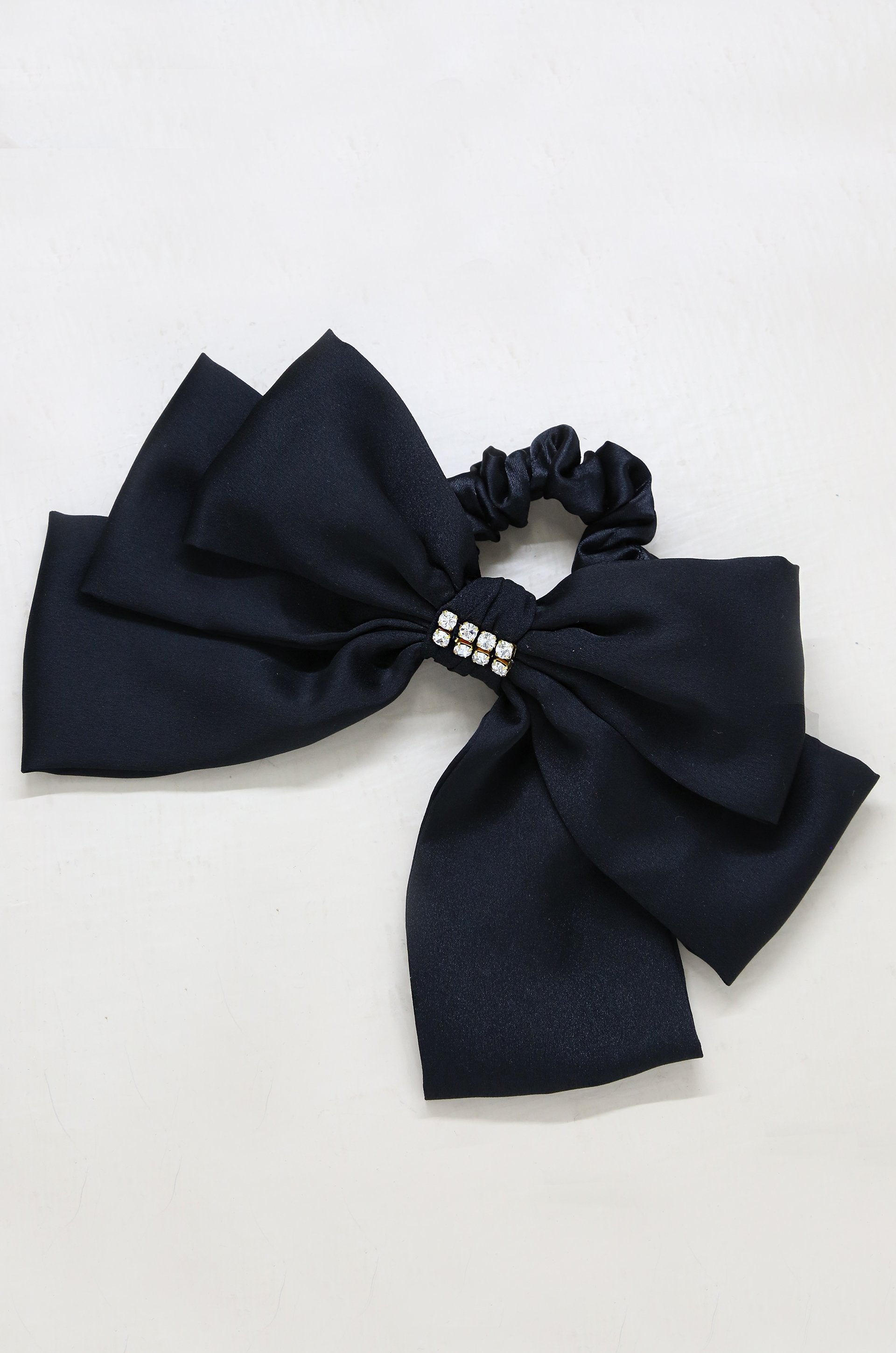 Oversized Bow Scrunchie with Crystal in Black on slate background  