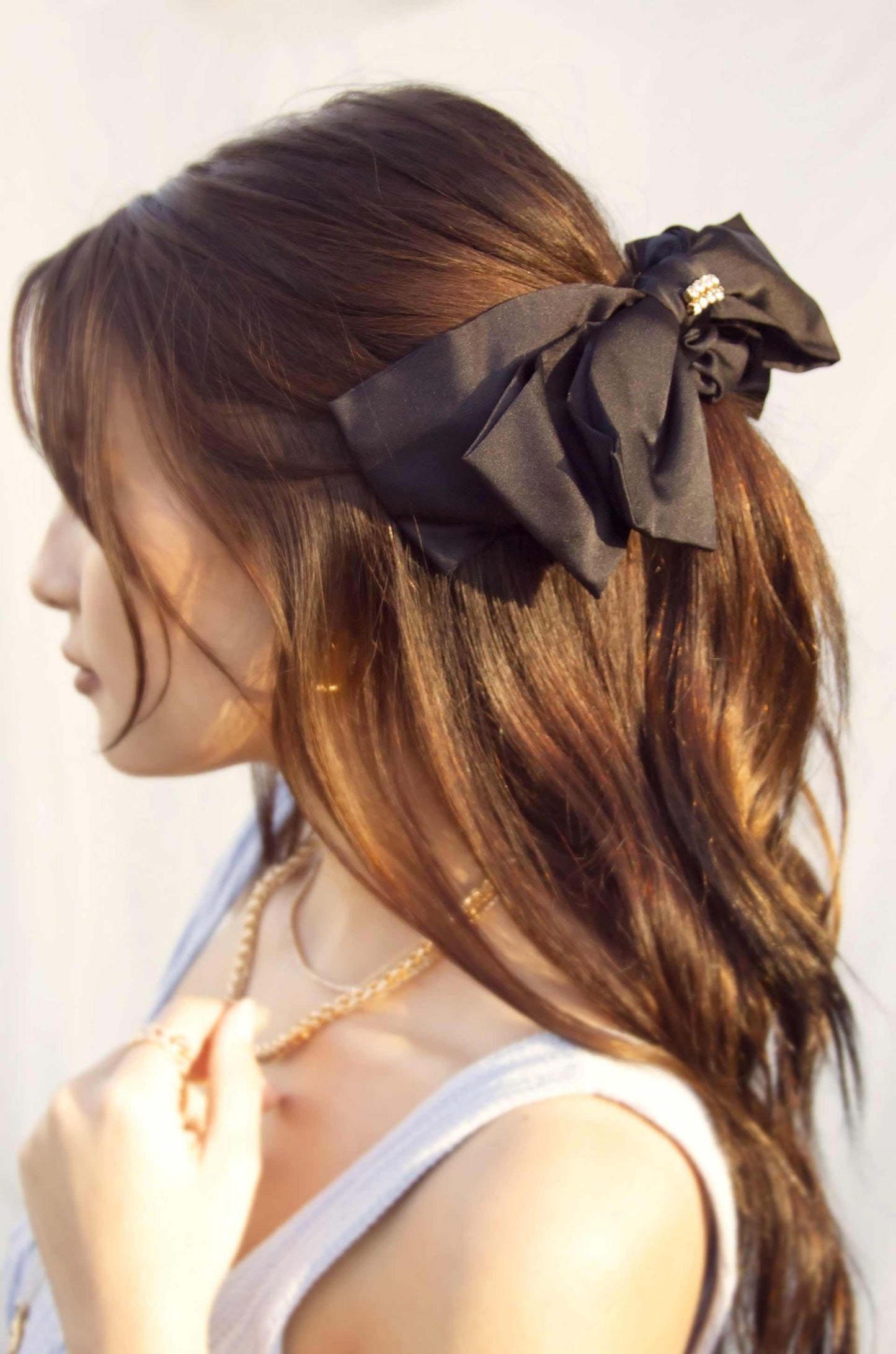 Oversized Bow Scrunchie with Crystal in Black on model