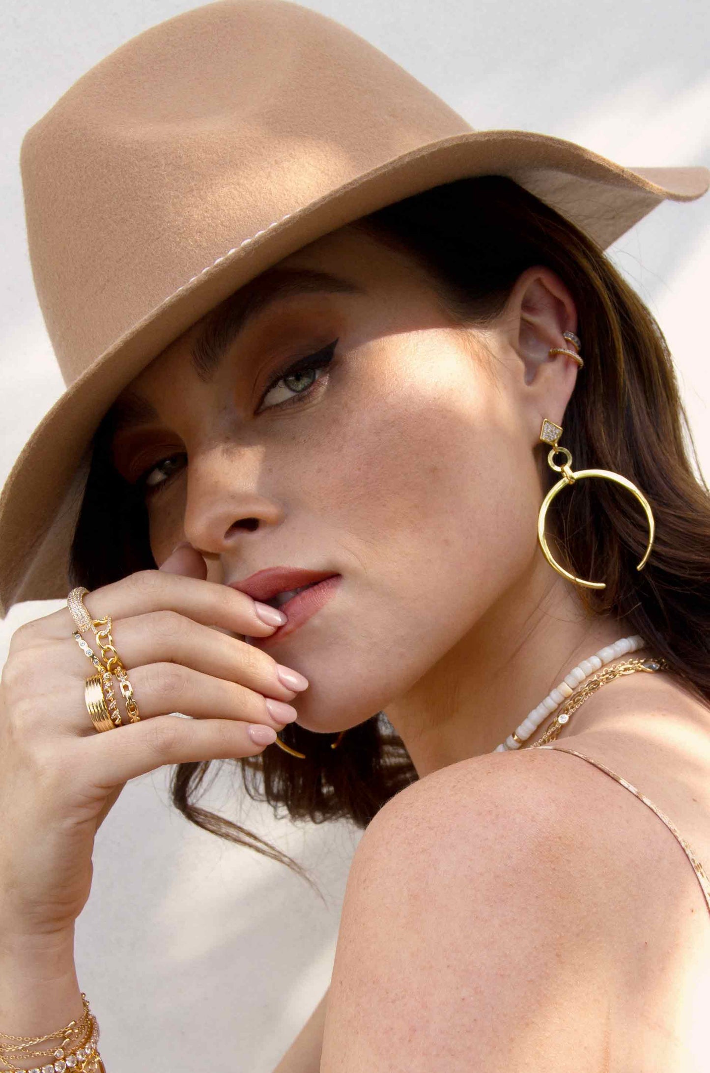 With the Band Hat in Tan with Pearls shown on a model  