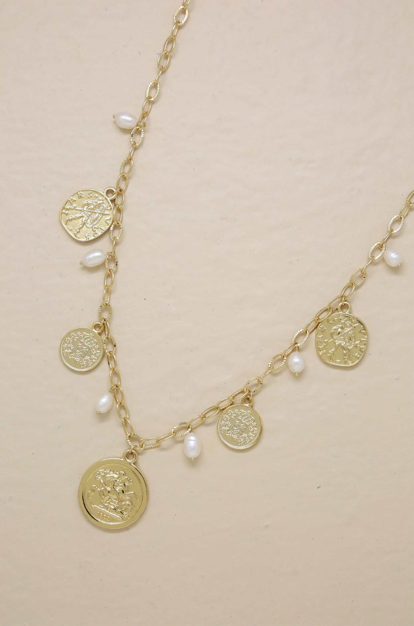 Treasure Hunter 18k Gold Plated Coin and Pearl Necklace on slate background  