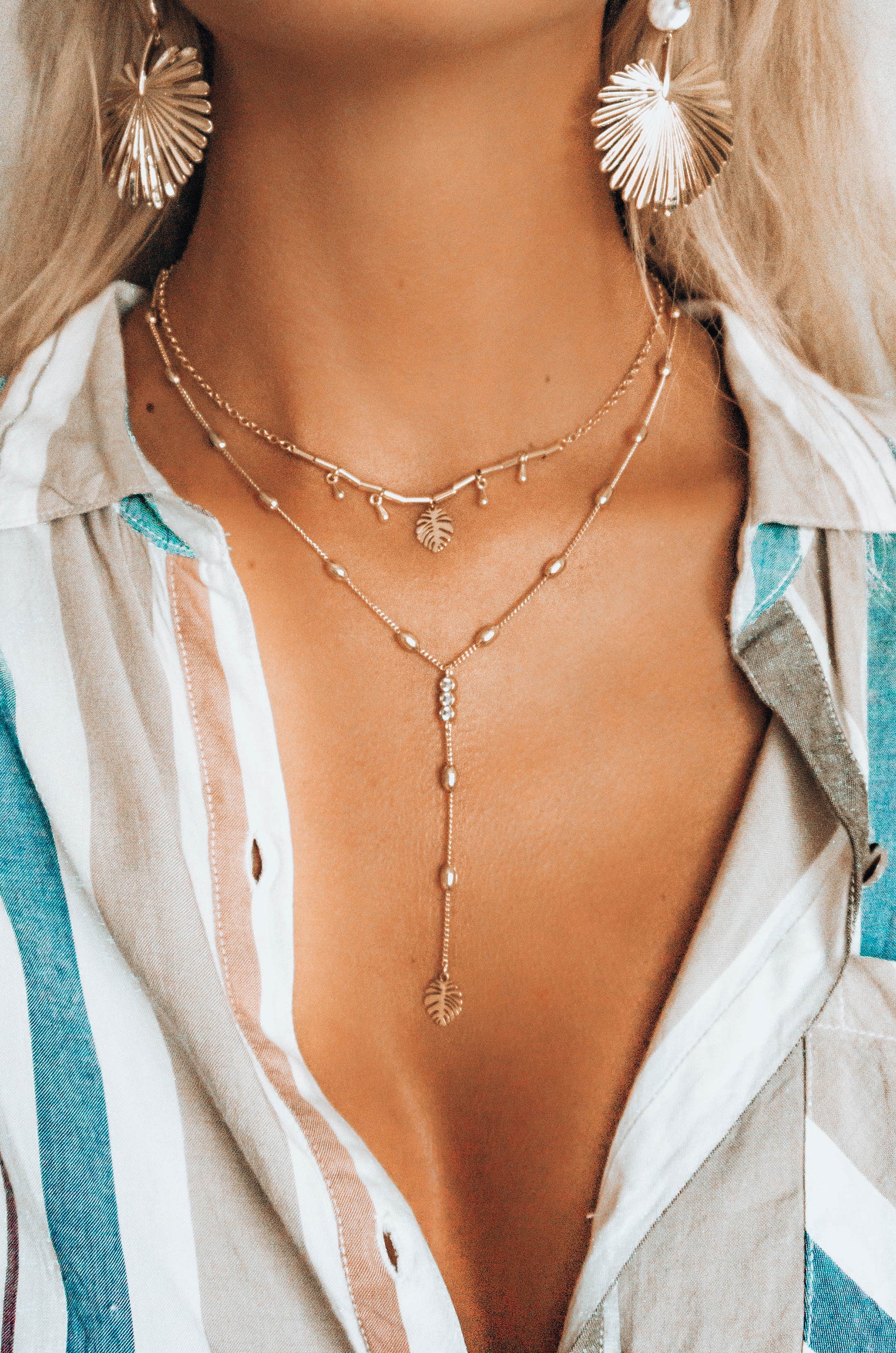 Under the Palms 18k Gold Plated Layered Lariat Necklace shown on a model  