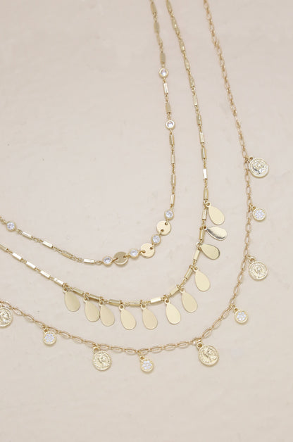 All You Need Layered Necklace Set on slate background  