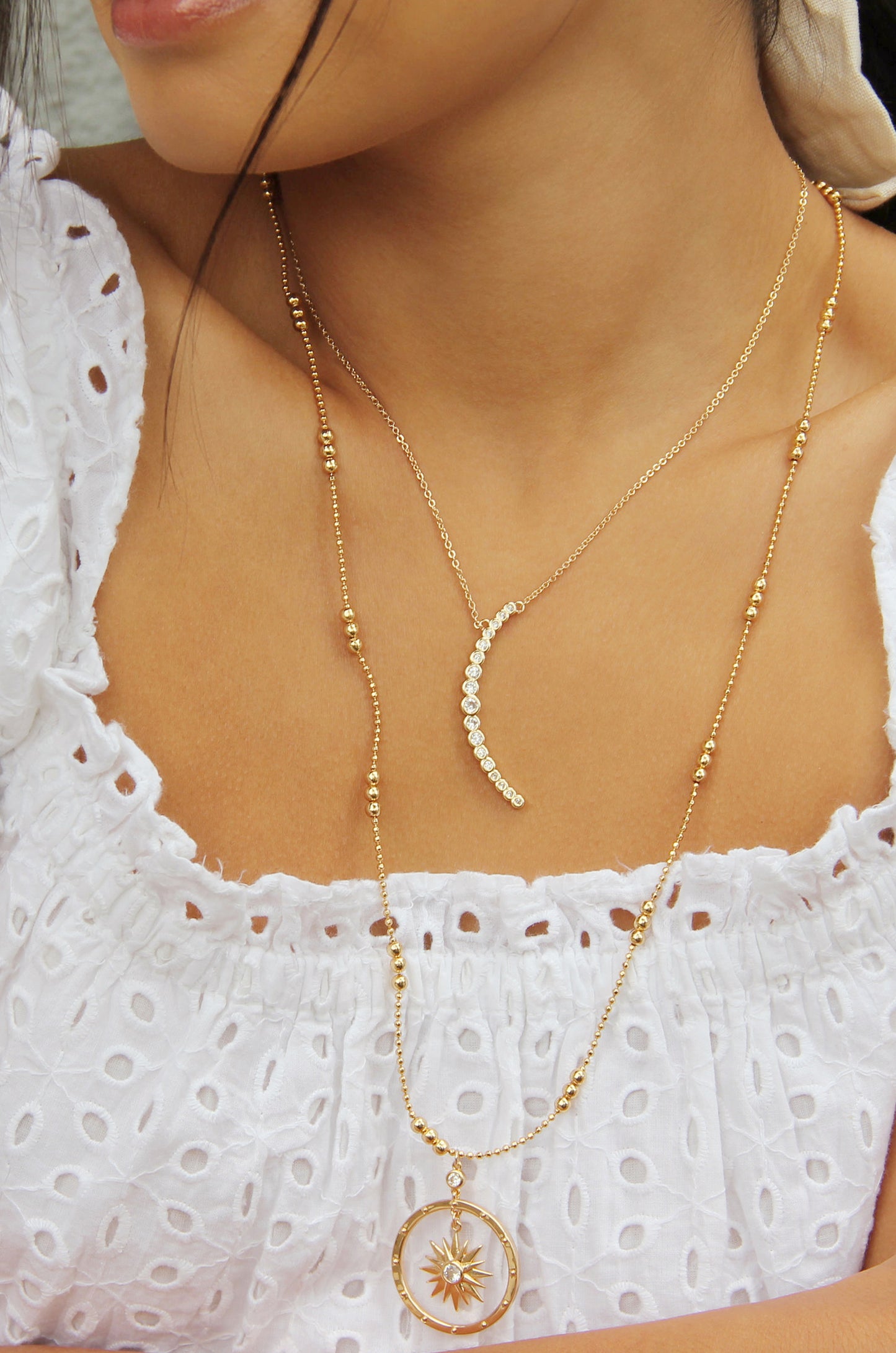 Waning Crystal Crescent Moon 18k Gold Plated Necklace shown on a model  