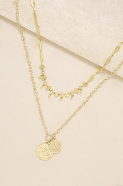 Stella Coin 18k Gold Plated Layered Necklace on slate background  