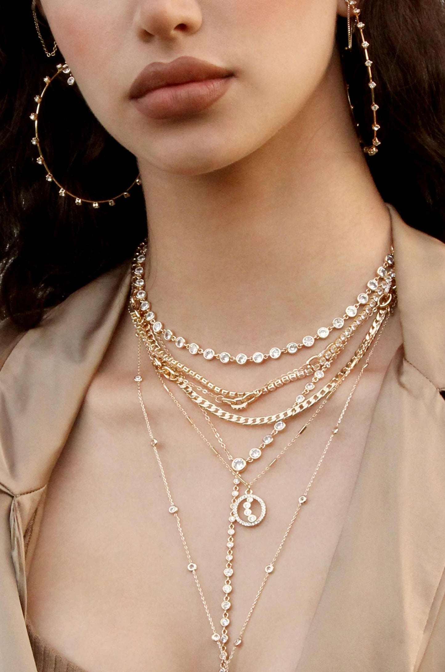 Triple Layered Crystal Detailed 18k Gold Plated Necklace shown on a model  