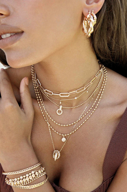 Dainty Crystal Trio 18k Gold Plated Necklace Set shown on a model  
