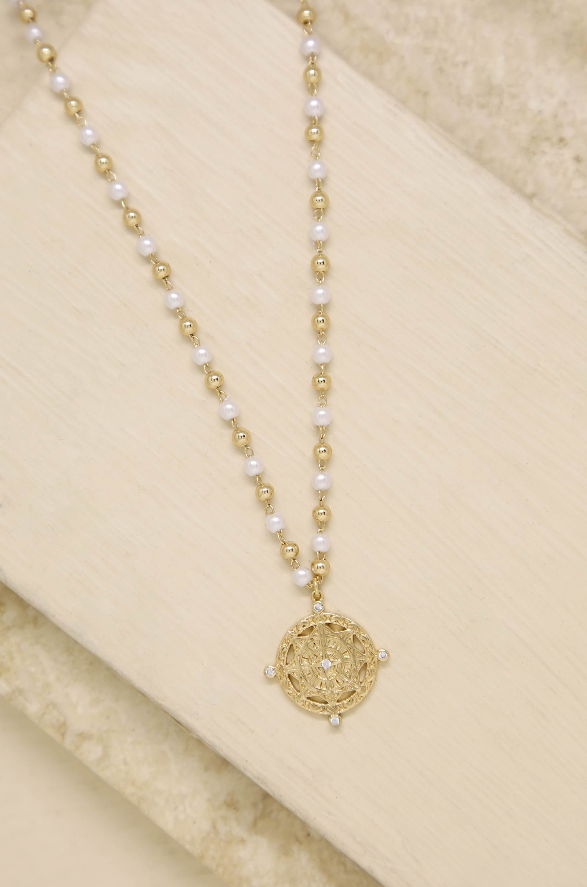 Long Travels Pearl & 18k Gold Plated Ball Chain Necklace on slate background  