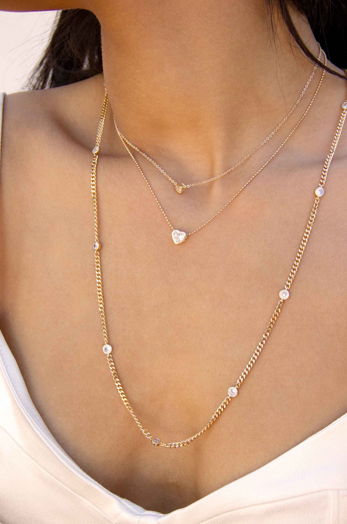 Simple Kind of Life Dainty 18k Gold Plated Chain and Crystal Layered Necklace Set on a model