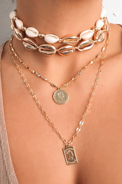 Cowrie Shell 18k Gold Plated Necklace shown on a model  