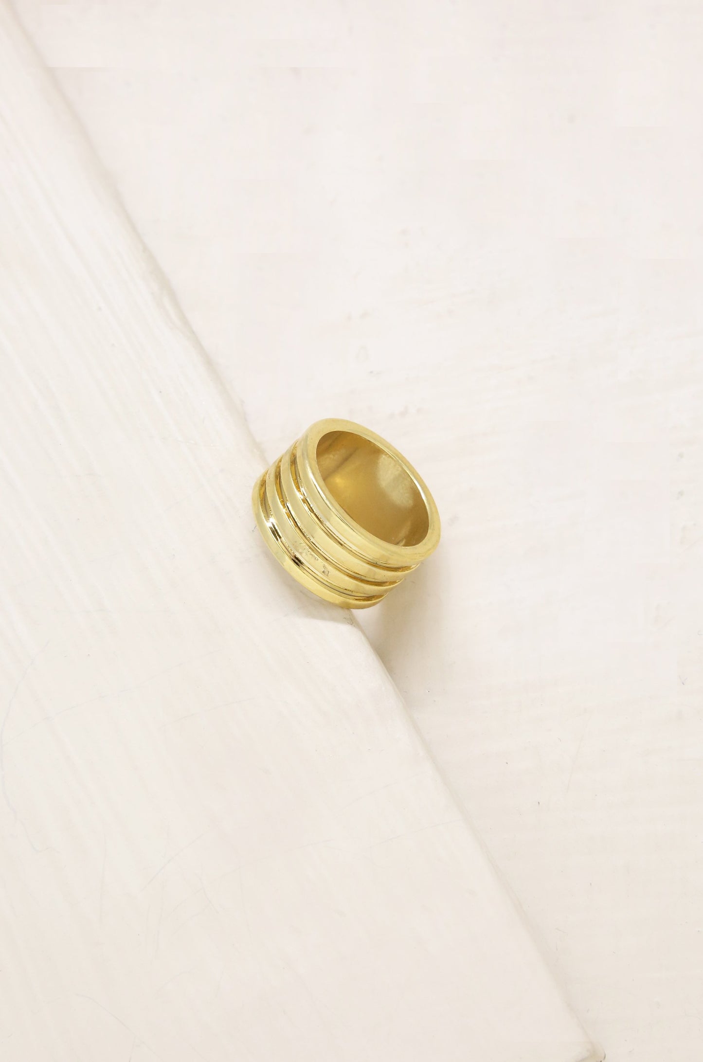 The Only Essential 18k Gold Plated Ring on slate backgroundThe Only Essential 18k Gold Plated Ring on slate background