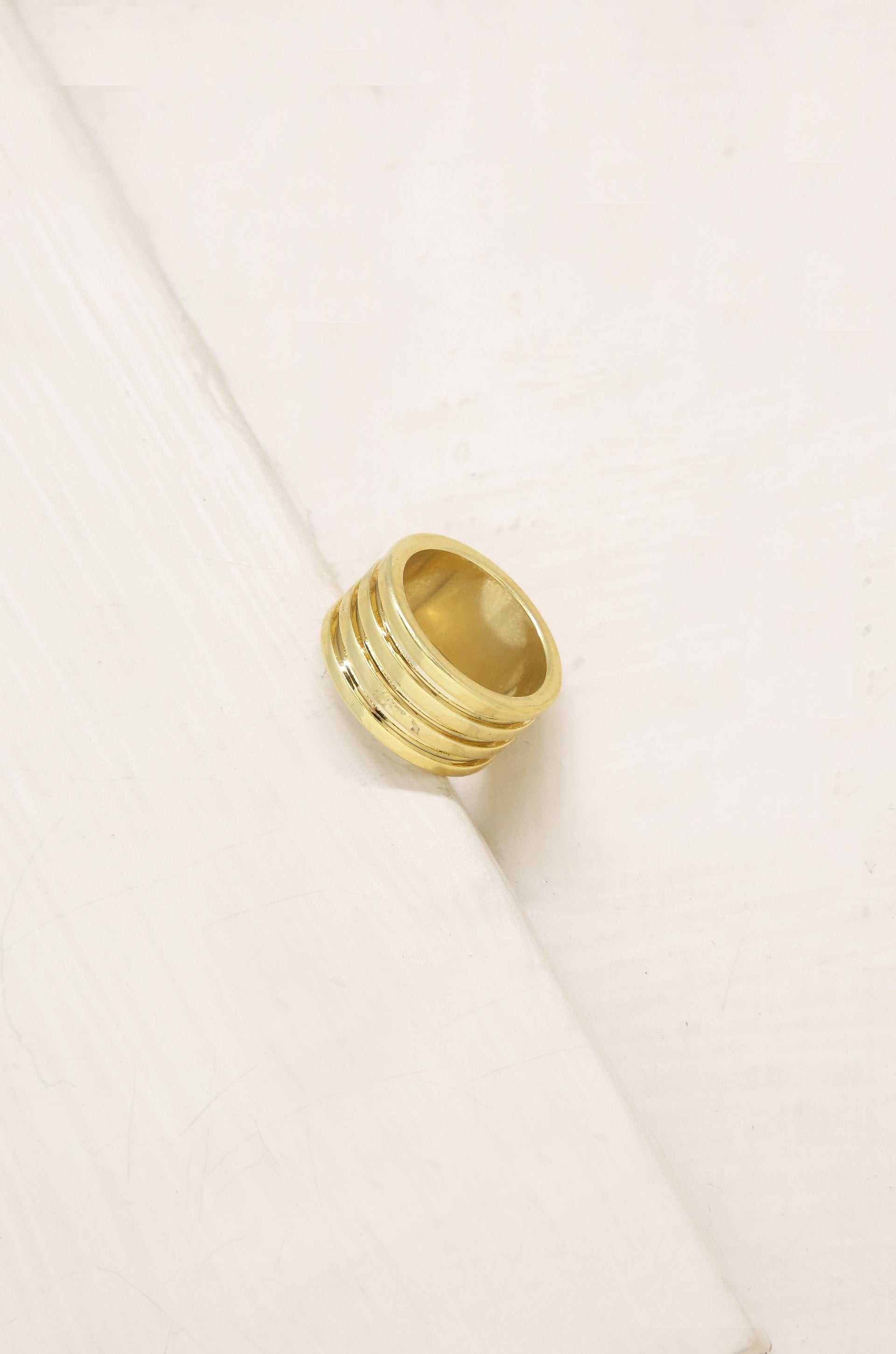 The Only Essential 18k Gold Plated Ring on slate backgroundThe Only Essential 18k Gold Plated Ring on slate background