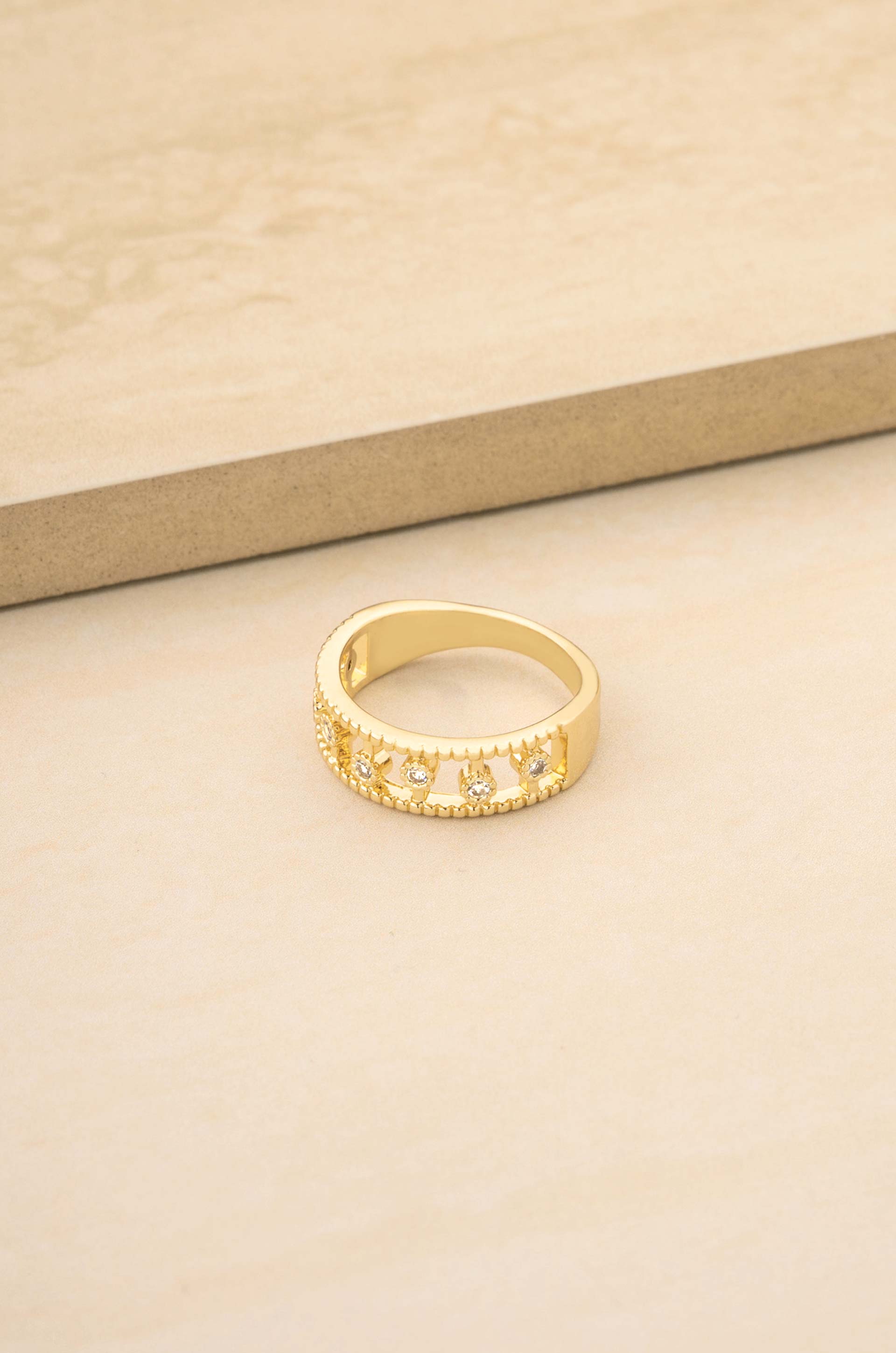 Femme Crystal Dotted 18k Gold Plated Ring on slate bakcgound
