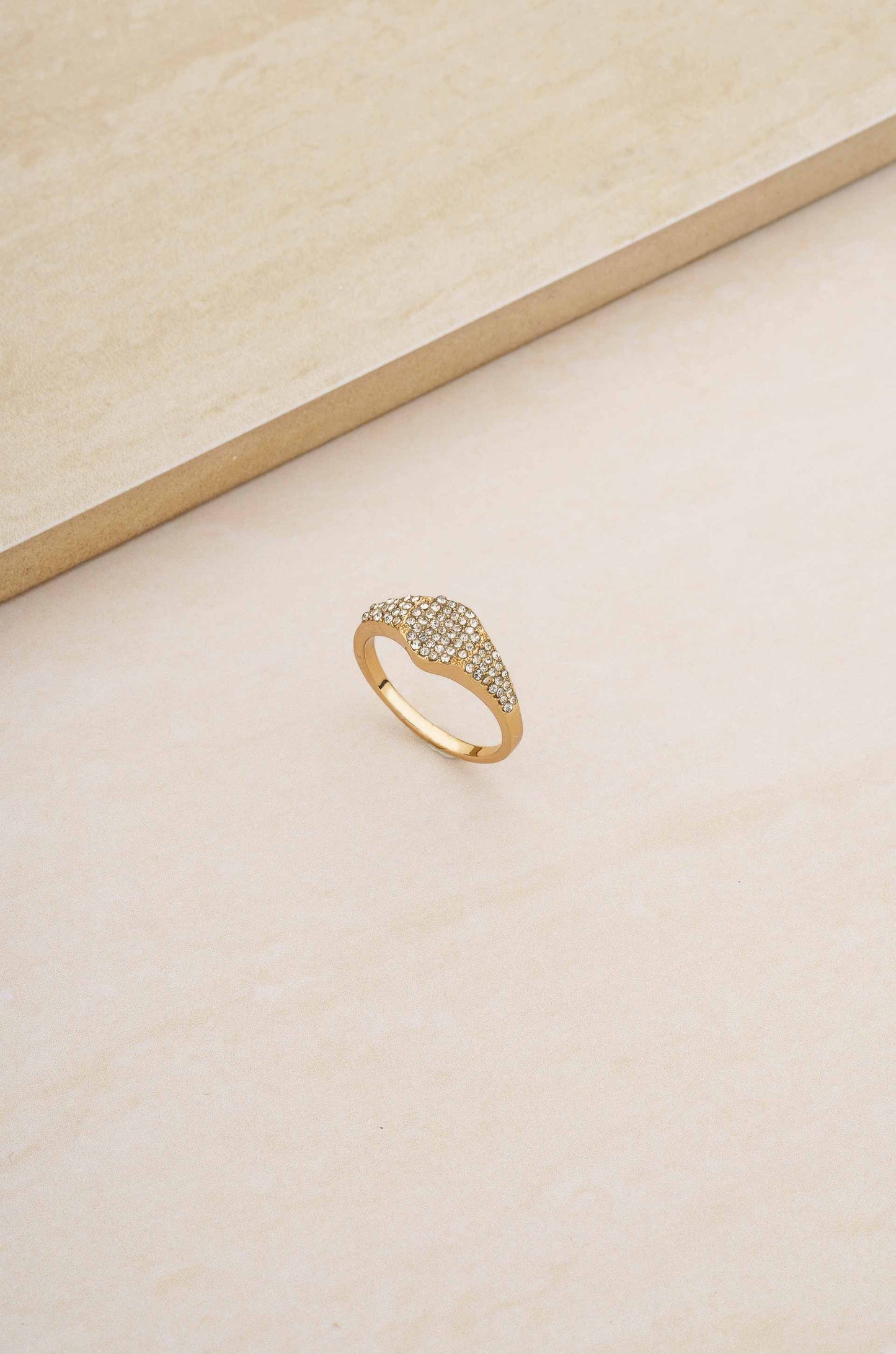 Femme Fatale Crystal 18k Gold Plated Ring on slate background