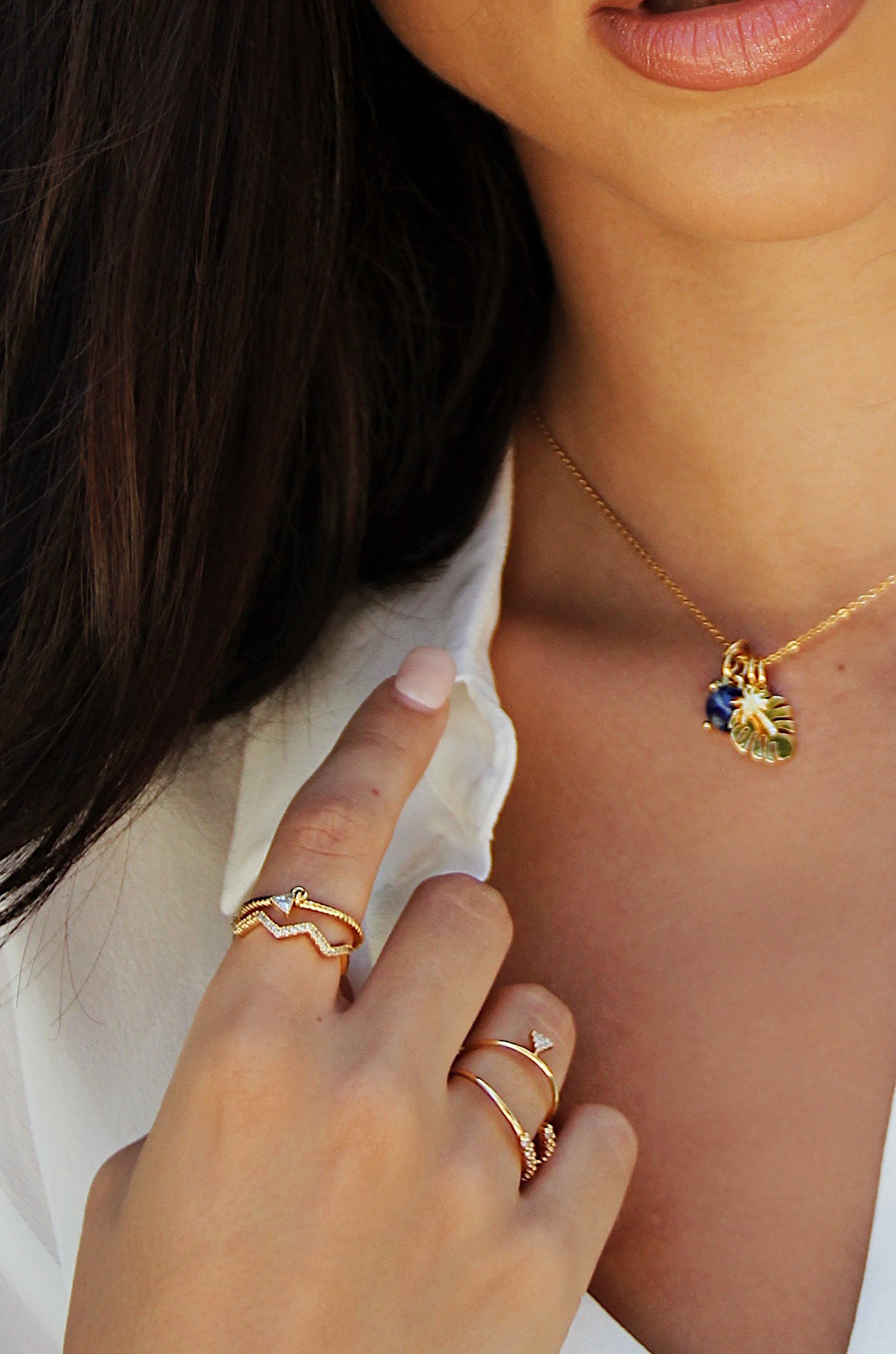 Geometric Dainty 18k Gold Plated Ring Set of 3 with Crystals shown on a model  