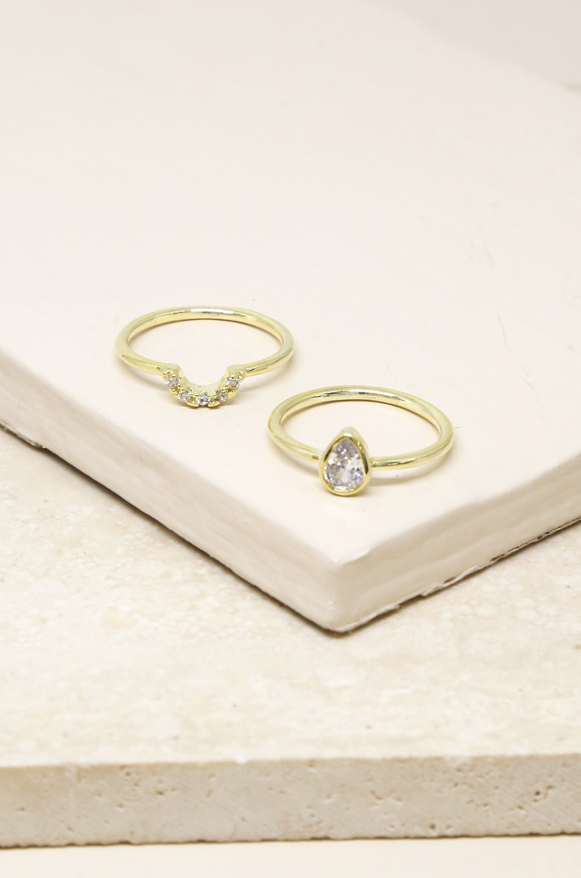 Perfect Fit Crystal 18k Gold Plated Stacking Ring Set on slate background  