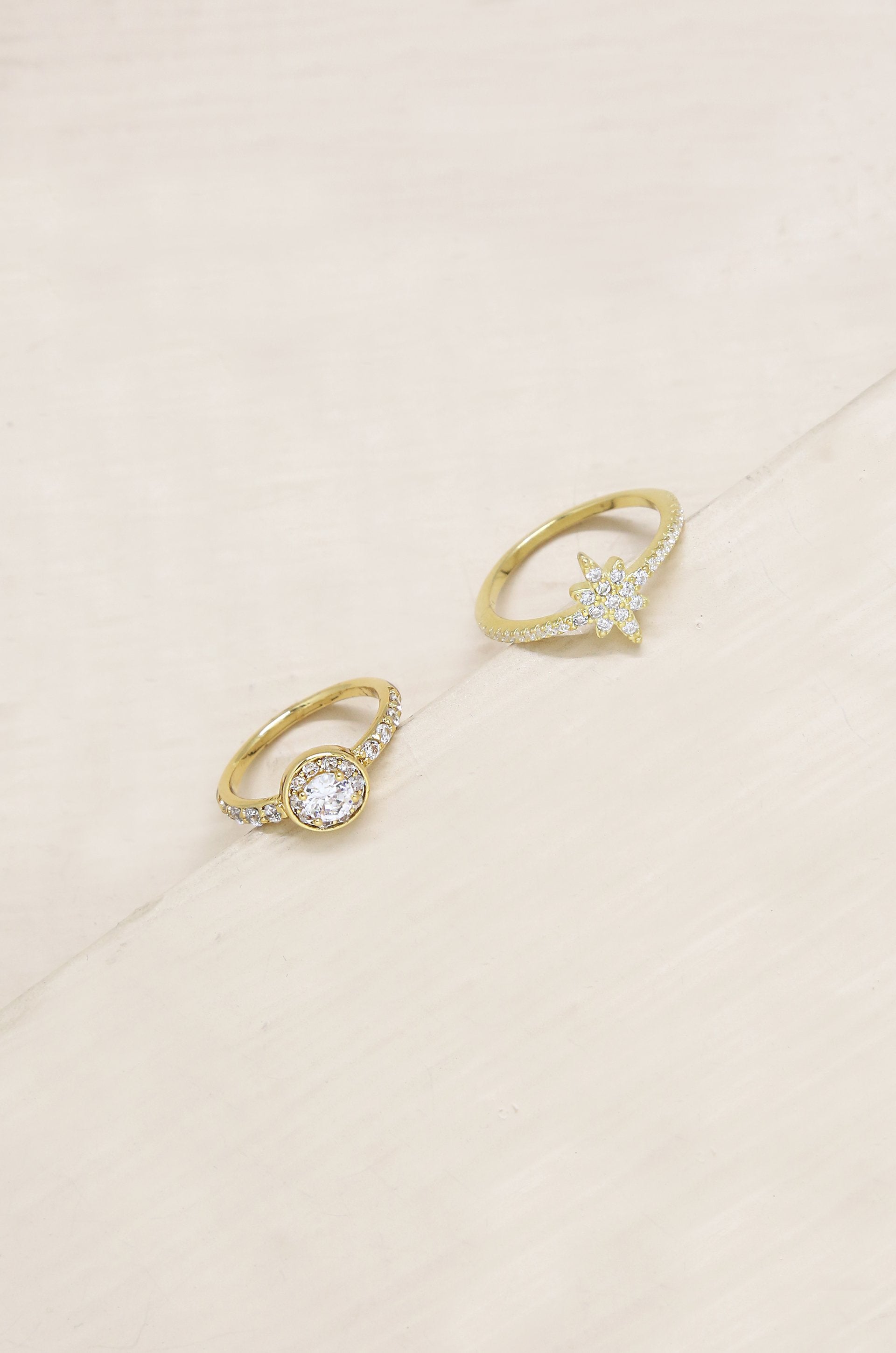 Star Studded Crystal 18k Gold Plated Ring Set on slate background