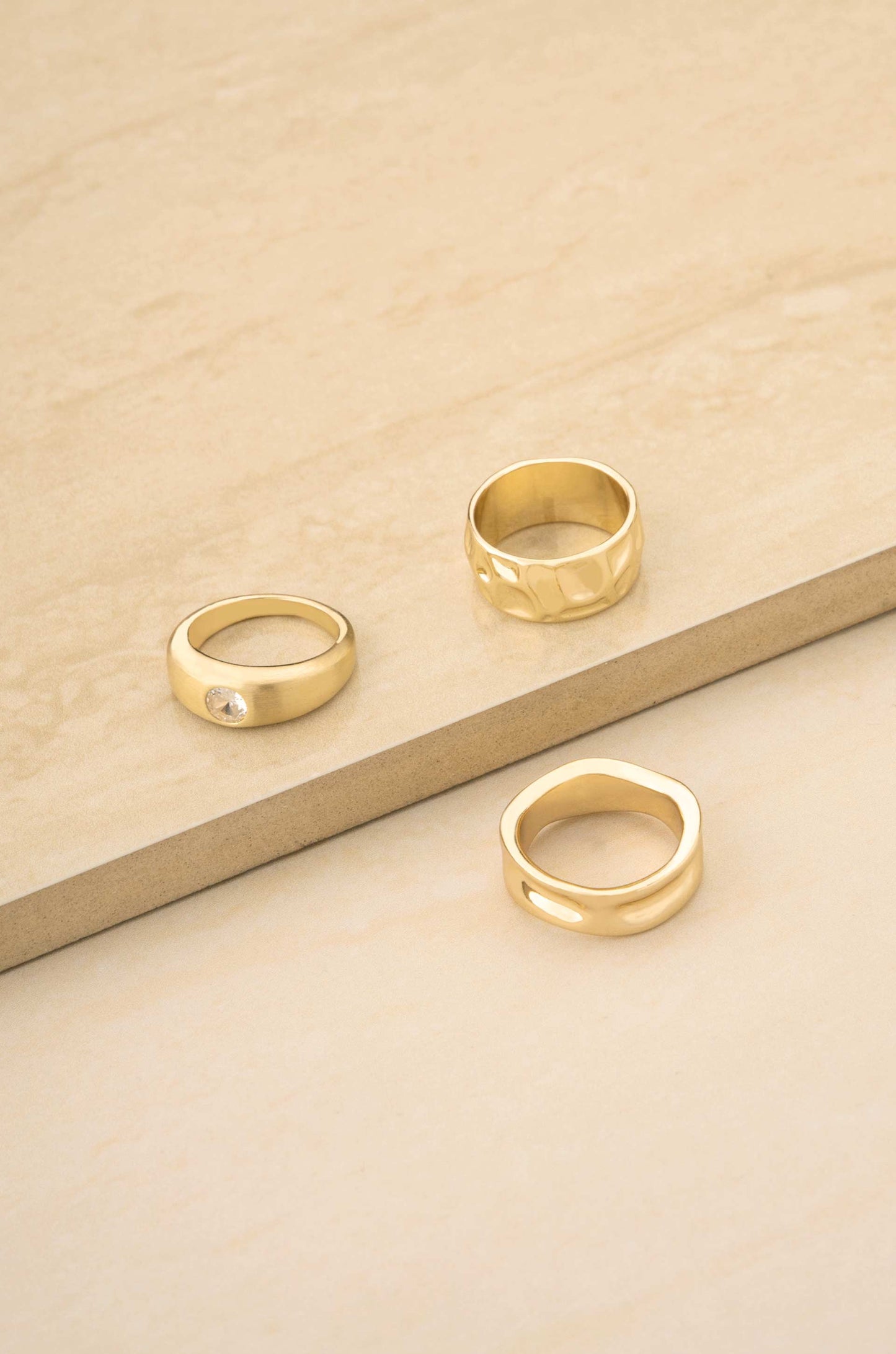 Hammered 18k Gold Plated Ring Set on slate background