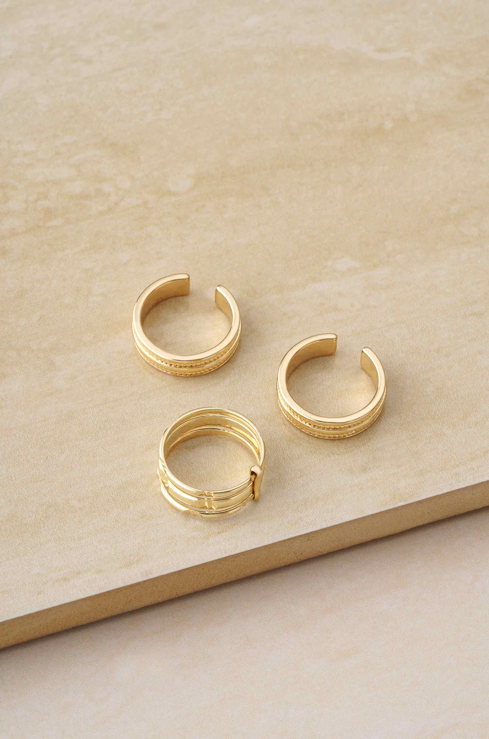Easy Golden Stackers 18k Gold Plated Ring Set on slate background